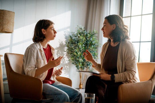 Professional Counseling Session with Therapist and Teenager
