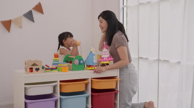 Woman and Girl Family Play with Colorful Toy Blocks, Child Birthday Celebration with Cake, Educational Activity, Storage Bin Organization, Joyful Mother Daughter Indoor Learning Moment
