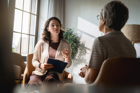 Professional Female Therapist Counseling Senior Woman