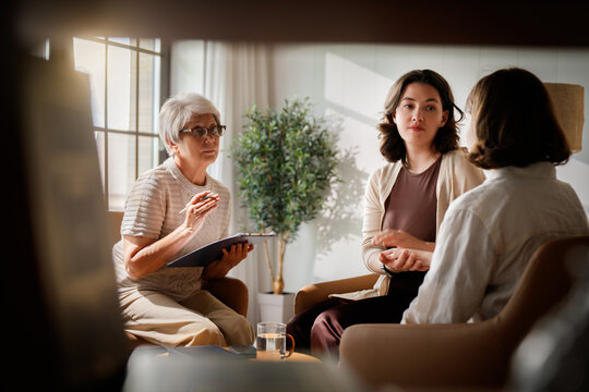 Professional Family Therapy Session with Psychologist in Bright Modern Office