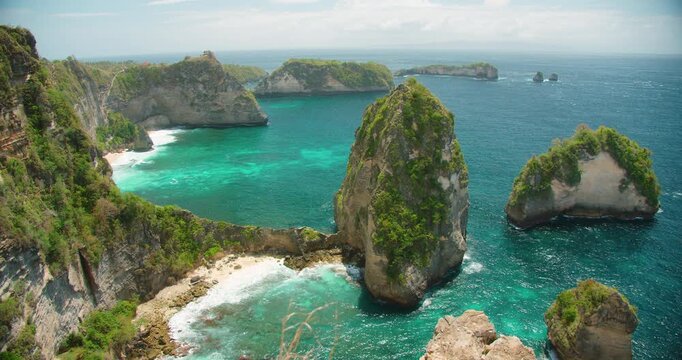 Dramatic coastal rocks rise from turquoise water near Diamond Beach on Nusa Penida Island Bali