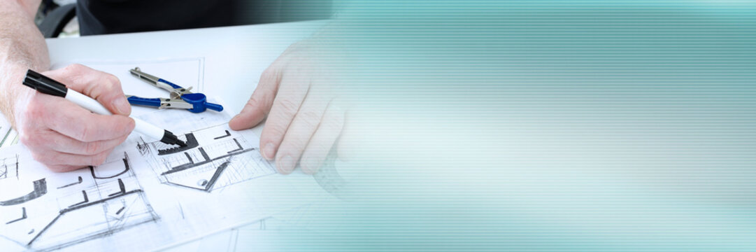 Architect working on plans; panoramic banner