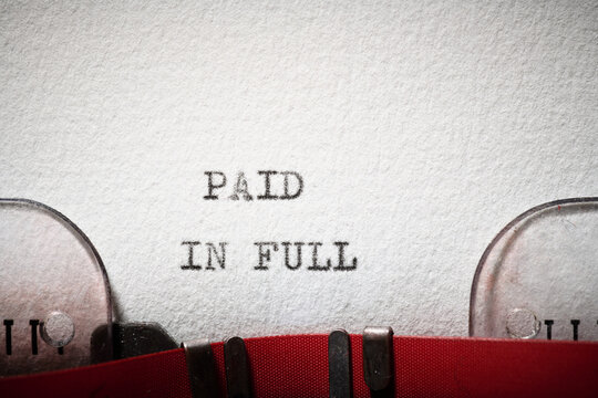 Paid in full text written with a typewriter.