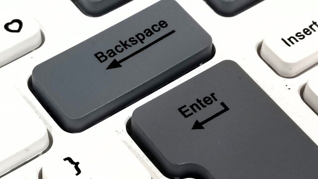 Macro Close Up of Backspace and Enter Key Buttons on Computer Keyboard Surface