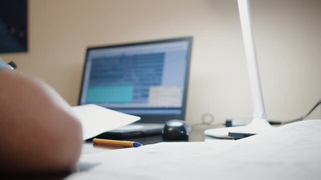 Hand Using Computer Mouse at Office Desk