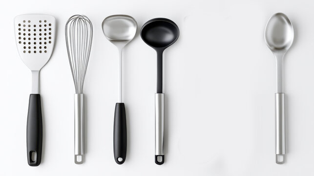 A collection of kitchen utensils, including a spatula, whisk, ladle, and spoon, laid out neatly