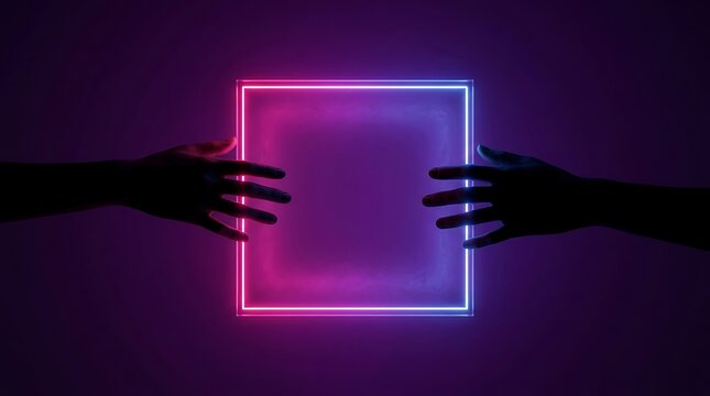 Silhouetted hands holding glowing neon square frame with vibrant pink and blue light against dark background