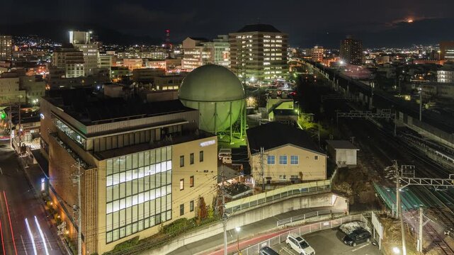 Dusk to night timelapse of Nagano City, the capital and largest city of Nagano Prefecture, Japan, zooming in. 