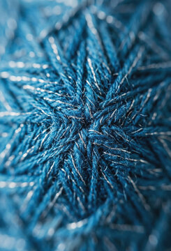 Close-up of blue yarn with metallic silver thread