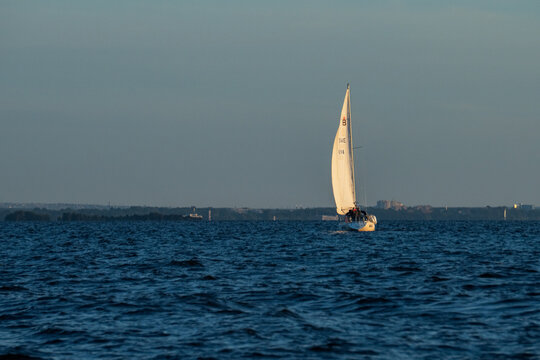 White sailing yacht boat luxury cruise on blue sea water at sunny day.
