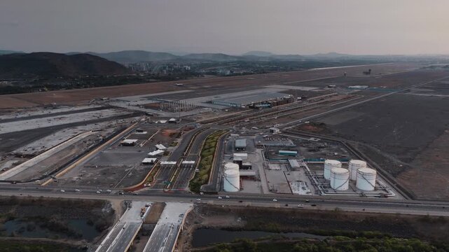 Aerial view of Navi Mumbai near Navi Mumbai International Airport, showing modern roads, scenic surroundings, and urban infrastructure. Ideal for smart city and development themes. 