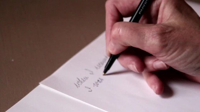 Person Writing A Note