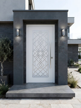 Luxury white front entrance door with decorative metallic patterns and dark stone framing on a modern house, entrance