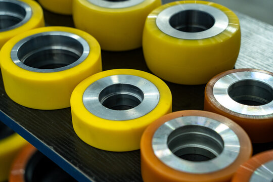 Polyurethane coated industrial wheels with metal hubs arranged neatly