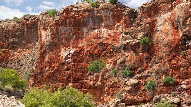 Sunny day at Yardie Creek capturing rocks, cliffs, and sparkling water during cruise