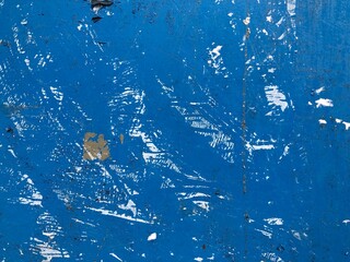 Blue and white torn street poster collage with weathered ripped paper layers and grunge textures © LilliM