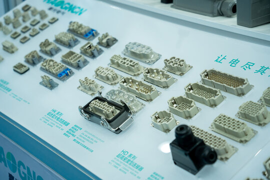 Various Heavy Duty Electrical Connectors Displayed on White Panel