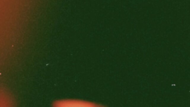 Retro VHS Dust and Scratches Overlay with Orange Light Leak Grain Texture