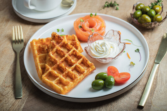 Crunchy waffle fries with sour cream dip served in a basket