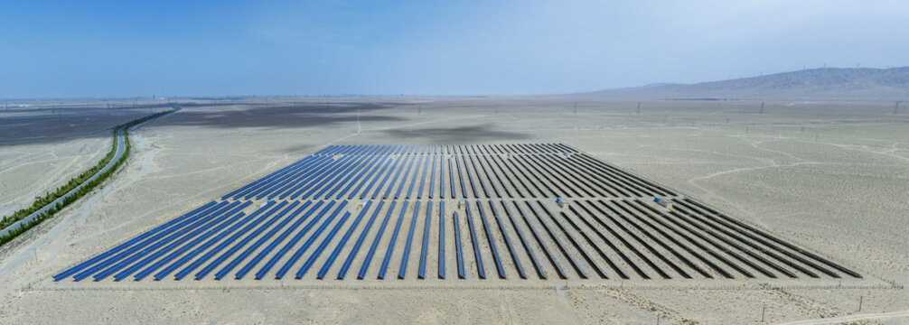 Aerial View of Solar Panel Array in Vast Desert Plain