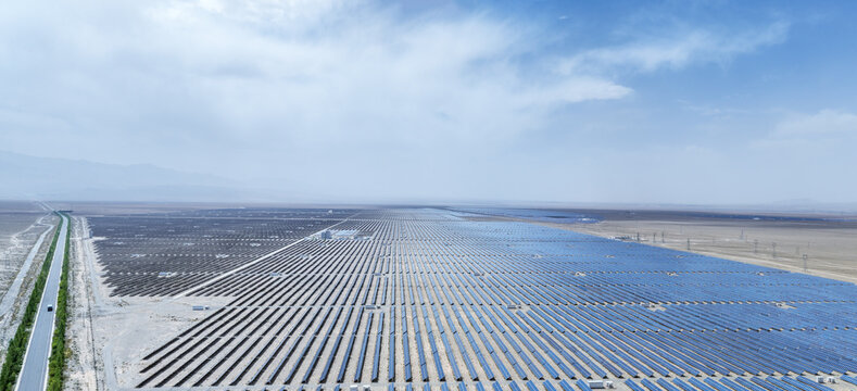 Aerial Panorama of Massive Solar Farm in Arid Desert Landscape