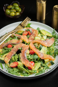 Salad with salted salmon and arugula
