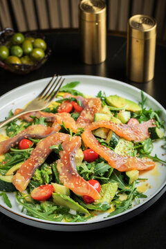 Salad with salted salmon and arugula
