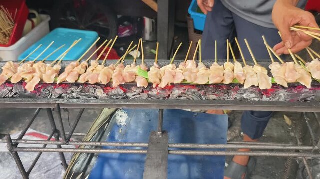 Raw Chicken Satay Sate Taichan Arranged on Charcoal Grill Hot Embers Burning Street Food Preparation Close Up
