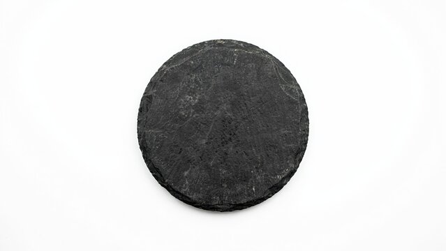 Circular coaster made of dark textured compressed felt material with compressed material accessory tableware