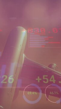 Animation of charts and financial data processing over aeroplane flying in cloudy sunset sky