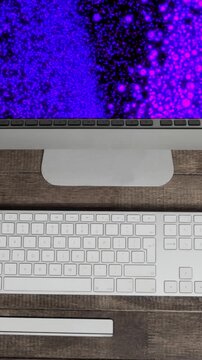Animation of technological devices with light spots on screen on desk
