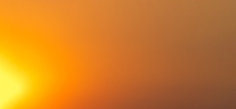 Smooth abstract orange and yellow gradient background featuring a soft glowing light source on the left, creating a warm sunrise or sunset atmosphere for graphic design use.