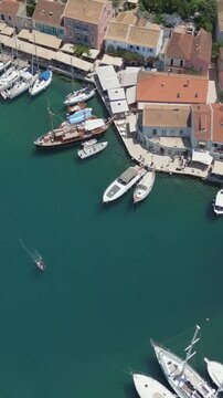 Vertical Aerial View of Fiskardo Village Port and Boats in Kefalonia Greece
