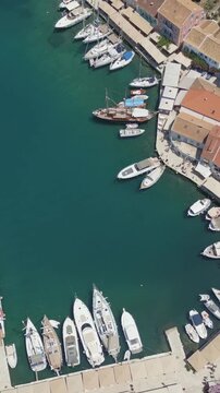 Vertical Aerial View of Fiskardo Village Port and Boats in Kefalonia Greece