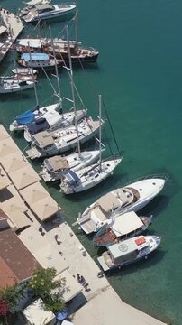 Vertical Aerial View of Fiskardo Village Port and Boats in Kefalonia Greece