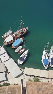 Vertical Aerial View of Fiskardo Village Port and Boats in Kefalonia Greece