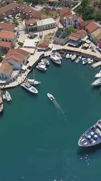 Vertical Aerial View of Fiskardo Village Port and Boats in Kefalonia Greece