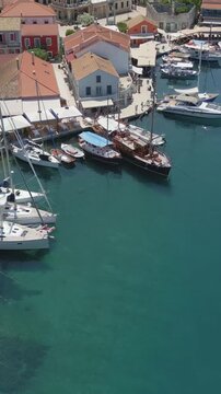 Vertical Aerial View of Fiskardo Village Port and Boats in Kefalonia Greece