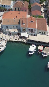Vertical Aerial View of Fiskardo Village Port and Boats in Kefalonia Greece