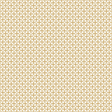 Golden quatrefoil pattern on beige background, seamless texture