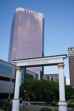 Atlantic City, New Jersey, U.S.A - Aug 16, 2026 - Bally's Hotel and Casino tower rises behind the Brighton Park archway, combining modern architecture with a public park entrance
