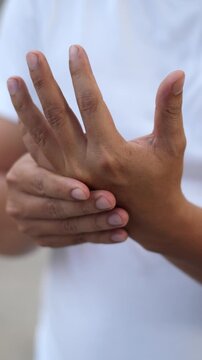 Closeup man holds his wrist. hand injury, feeling pain. Health care and medical concept. and those with a family history of degenerative knuckles.	