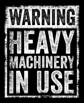 WARNING HEAVY MACHINERY IN USE grunge sign featuring distressed capital letters inside a textured layout for industrial safety and caution themes.