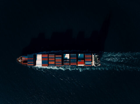 Aerial View Of A Loaded Cargo Container Ship Navigating Deep Ocean Waters Off The Coast Of Si Racha Chon Buri Thailand For Global Maritime Trade And Freight Distribution
