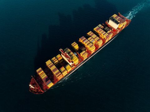Large Cargo Vessel Transporting Shipping Containers Across Open Sea Waters In Si Racha Chon Buri Thailand For Global Maritime Trade And International Freight Logistics