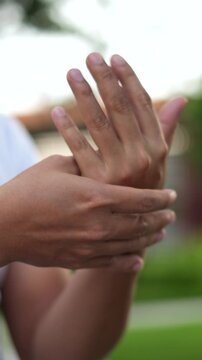 Closeup man holds his wrist. hand injury, feeling pain. Health care and medical concept. and those with a family history of degenerative knuckles.	