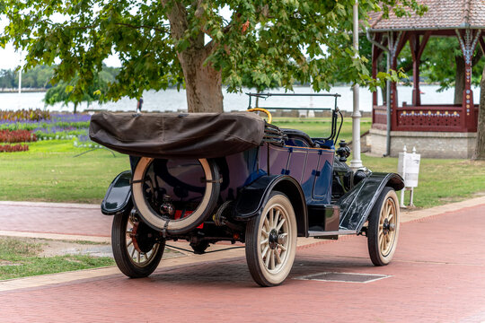 Centennial 1914 Maxwell Model 25 vintage touring car rear view showing spare tire, wooden artillery wheels and folded soft top, Park Palic, Serbia, Jul 5, 2026