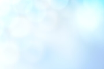 Fototapeta premium 青背景にキラキラ光る玉ボケの背景素材 抽象背景