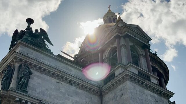 Saint Isaac's Cathedral shines brightly against the sunny sky in Saint Petersburg. This majestic architecture evokes awe and peaceful joy.