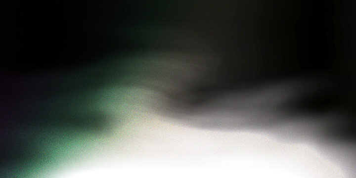 Abstract blurred background of a nighttime cityscape with green and white lights